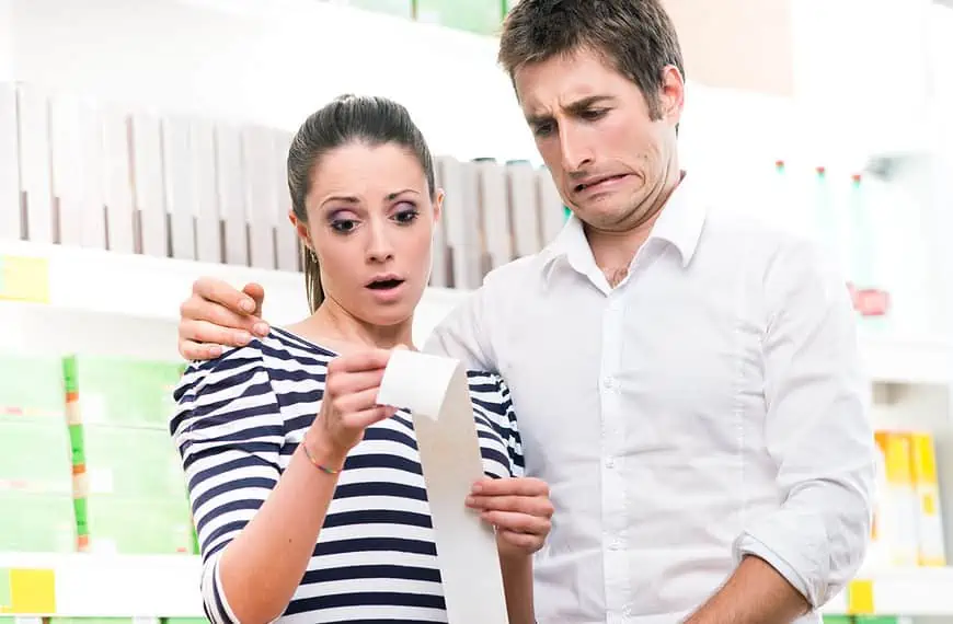 surprised couple reading receipt